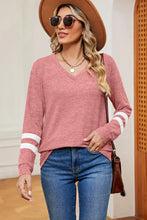 Women’s pink long sleeve V-neck top with white arm stripes