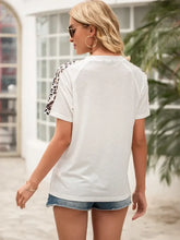 Ivy Lane Pocketed Leopard Round Neck Short Sleeve T-Shirt Woman T Shirts