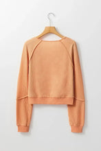 Peach V neck long sleeve waffle knit top with raglan sleeves