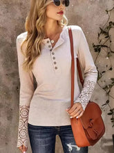 Women’s long sleeve henley shirt with lace cuffs and button round neck