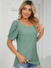 Woman in light green eyelet ruched notched long sleeve T-shirt