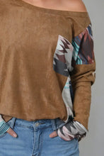 Camel-colored geometric drop shoulder T-shirt with patterned sleeves and pocket