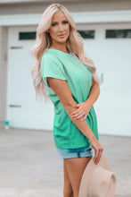 Light green round neck pocket tee shirt with short sleeves