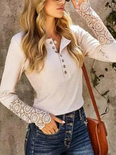 Women’s long sleeve henley shirt with lace cuffs and button round neck