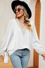 Womens white long sleeve V-neck blouse with embroidered trim