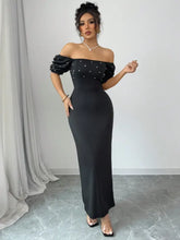 Black satin off-shoulder gown with pearl embellishments and puff sleeves