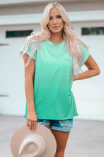Woman in round neck pocket tee shirt with ombré green and denim shorts
