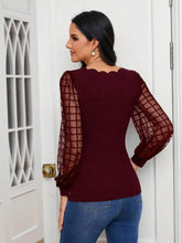 Burgundy scalloped V-neck blouse with sheer plaid sleeves