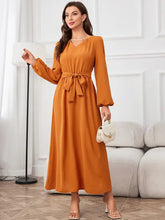 Orange tie waist puff sleeve maxi dress with bell sleeves and pockets