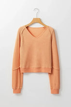 Peach V-neck long sleeve waffle knit top with ribbed cuffs