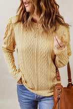 Light yellow cable knit round neck long sleeve blouse with puff sleeves