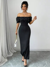 Black satin off-the-shoulder gown with pearl embellishments and puff sleeves