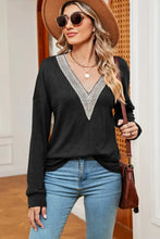 Black long-sleeve V-neck dropped shoulder sweater with white crochet trim