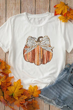 White pumpkin graphic tee with leopard bow and wood texture