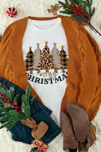 White short sleeve t-shirt with merry Christmas graphic of plaid and leopard print trees under open-front burnt orange cable-knit cardigan