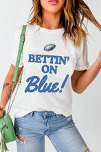White T-Shirt with Blue Football Graphic and Bettin on Blue Text Woman T Shirts