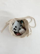 Woven Drawstring Purse with Floral Embellishment Shoulder Bags