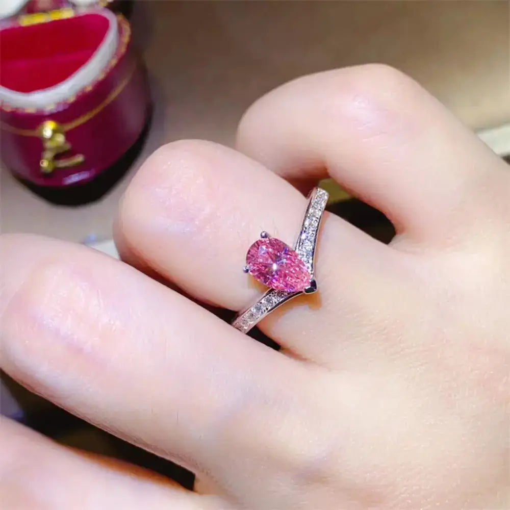Elegant 1 carat moissanite sterling silver ring with pink pear gem.