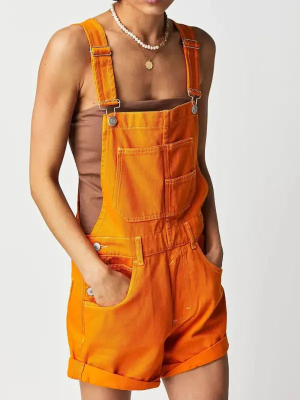 Square neck wide strap denim overalls in bright orange with rolled cuffs