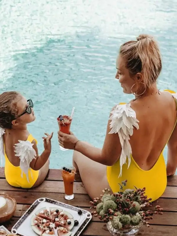 Yellow one-piece swimsuit with stylish comfort feather accents for toddler outerwear