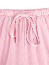 Pink ribbed knit tied wide leg pants with elastic waistband and matching drawstring bow detail