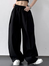 Black oversized wide leg casual pants with elastic waistband and flowing silhouette machine wash tumble dry care instructions