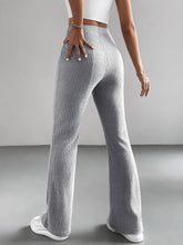 Gray ribbed knit high-rise flare pants featuring a ribbed knit texture and a high waist design
