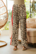 Bi bi leopard print pants with red side stripes drawstring waist and tucking welt pockets for casual wear
