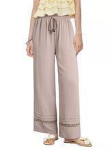 Beige casual wide-leg pants with drawstring waist and lace trim cuffs for comfortable everyday wear