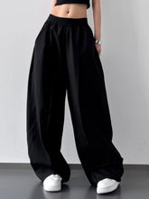 Black oversized wide leg casual pants with elastic waistband and relaxed silhouette suitable for machine wash tumble dry care instructions