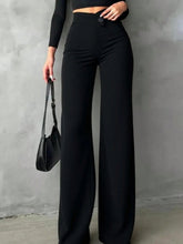 Black high waist wide leg pants with sleek silhouette and button closure, machine wash and tumble dry care instructions