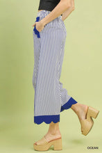 Blue and white vertically striped umgee stripe scallop wide leg pants with scallop hem fabric cuffs