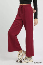 Umgee cable knit burgundy wide leg pants with a drawstring waistband and soft flowing fabric for comfort
