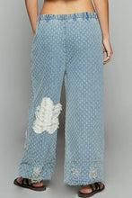 Light blue denim wide-leg pants with white dot pattern distressed frayed knees featuring pol floral patch design