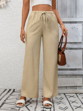 Beige drawstring high waist wide leg pants with elastic waist designed for comfortable casual wear