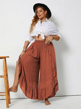 Rust-colored plus size ruffled wide leg pants made from lightweight fabric for comfortable wear