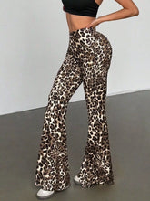 Leopard print high waist flare pants in stretchy fabric featuring bold brown and cream leopard print spots