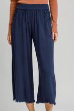 Navy blue umgee plus size wide leg pants with elastic waistband linen blend fabric and frayed hem side pockets