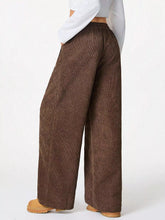 Brown corduroy wide leg pants with a relaxed fit and elastic waistband for comfortable everyday wear