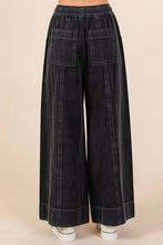 Black mineral wash wide-leg twill pants with elastic waistband and large patch pockets featuring contrasting stitching