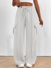 Light gray casual high waist cargo pants with wide legs, drawstring waist, and large side pockets for comfort