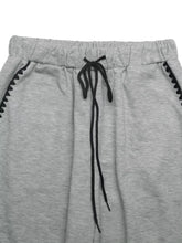 Gray heathered wide-leg drawstring pants with black drawstrings and zigzag stitch detail suitable for machine wash care instructions