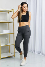 Black cropped joggers from leggings depot featuring a sleek tapered fit wide waistband and subtle side pockets