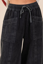 Black mineral wash wide-leg twill pants with drawstring waistband and contrasting light stitching by mittoshop