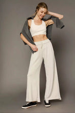 Off-white wide leg pants by Umgee made of cotton with an elastic drawstring waistband for comfortable wear