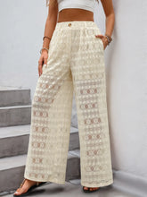 Cream-colored lace decorative button wide leg pants with high waist and button closure for elegant wear