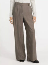 Brown pinstripe wide leg pants with tailored waistband and subtle vertical stripes in striped wide leg design