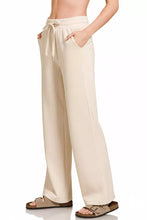 Cream-colored Zenana scuba wide leg pants with elastic waistband and matching drawstring in soft scuba material