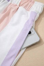 Pastel-striped cotton joggers featuring a soft pink white and lavender stripe multicolored print drawstring loose fit with side pockets