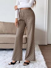 Brown and beige plaid high-waisted wide leg pants made from soft material with easy care instructions
